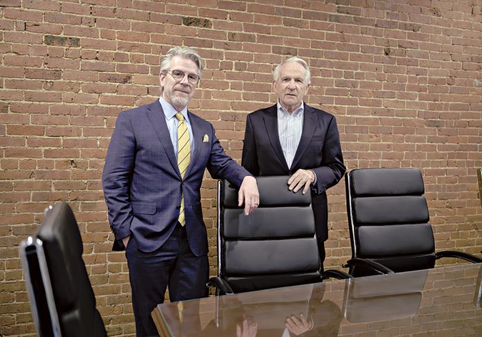 HOLDING COURT: Attorney Mark Mandell, right, has donated $4 million to create a trial advocacy center at the Roger Williams University School of Law. The center will help train law students and practicing lawyers on skills needed in the courtroom. With Mandell is Gregory Bowman, dean and professor at RWU’s law school.  PBN PHOTO/MICHAEL SALERNO