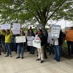 Protesters, union urge Roger Williams University to end staff furloughs