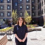 Raising the roof: Michelle Wilcox, CEO of Crossroads Rhode Island, was recognized for her work with the 2026 Women Leading the Way award by U.S. Rep. Seth Magaziner, D-R.I.  PBN PHOTO/­TRACY JENKINS