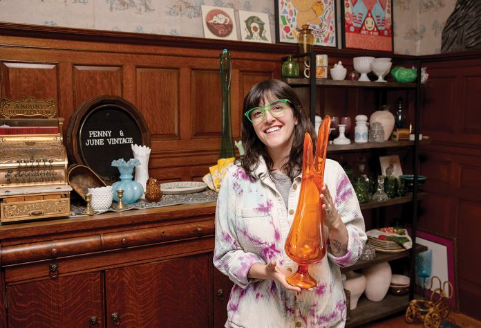 UNIQUE ITEMS: Andrea Belanger, owner of the online boutique and reseller Penny & June Vintage, holds up one of her glassware pieces. PBN PHOTO/TRACY JENKINS