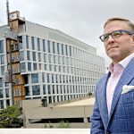 CHANGING MARKET: Leeds M­itchell IV, principal broker and partner at MG Commercial Real Estate, says the post-pandemic Providence office market is smaller but stable. Behind him is Brown University’s 300,000-square-foot integrated life sciences research facility.  PBN FILE PHOTO/­MICHAEL SALERNO