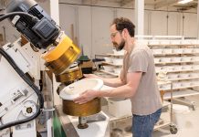 IN PROGRESS: Co-owner Eric Smallwood works with a product at tableware manufacturer Myrth Ceramics in East Providence. PBN PHOTO/TRACY JENKINS