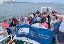 SMOOTH SAILING: The Sansiveri team enjoys a sunset cruise in Newport to celebrate the firm’s 50th anniversary.  COURTESY OF SANSIVERI, KIMBALL AND CO. LLP