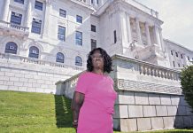 GIVING VOICE: Ann Clanton, founder and owner of Ann Clanton Communications, is pictured in front of the R.I. Statehouse. PBN PHOTO/MICHAEL SALERNO