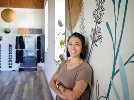 IN A GOOD PLACE: ­Physical therapist Amy Smith decided to launch her own therapy business with her wife, Emily Smith, in 2020. Roots Physical Therapy and Yoga has grown ever since.  PBN PHOTO/­MICHAEL SALERNO