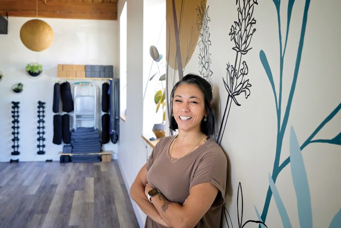 IN A GOOD PLACE: ­Physical therapist Amy Smith decided to launch her own therapy business with her wife, Emily Smith, in 2020. Roots Physical Therapy and Yoga has grown ever since.  PBN PHOTO/­MICHAEL SALERNO