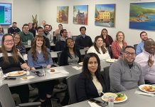 CHOW TIME: CBIZ staff members in Rhode Island enjoy a meal together as they review the firm’s performance for 2025. COURTESY CBIZ INC.