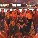 FRIENDLY COMPETITION: Chisholm, Chisholm and Kilpatrick employees enjoy a night out on the bowling lanes.  COURTESY CHISHOLM, CHISHOLM AND PATRICK LTD.