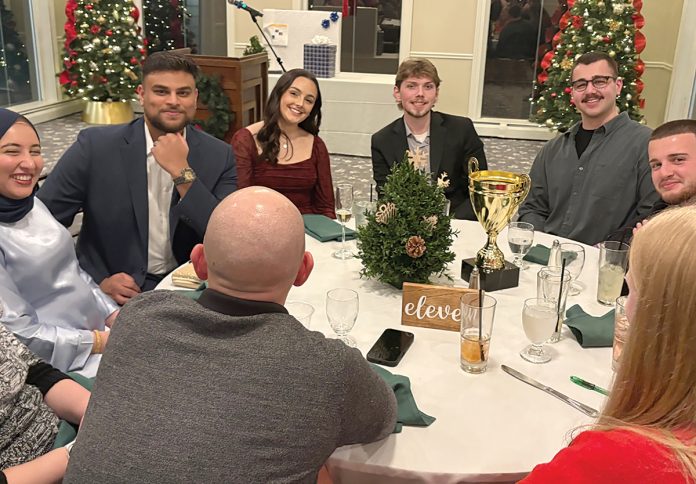 FEELING CHEERY: Citrin Cooperman employees are all smiles at a company holiday gathering.  COURTESY CITRIN COOPERMAN & CO. LLP