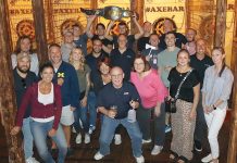 Compass IT Compliance SHARP CROWD: Compass employees try their hand at axe-throwing during a company outing.
COURTESY COMPASS IT COMPLIANCE LLC