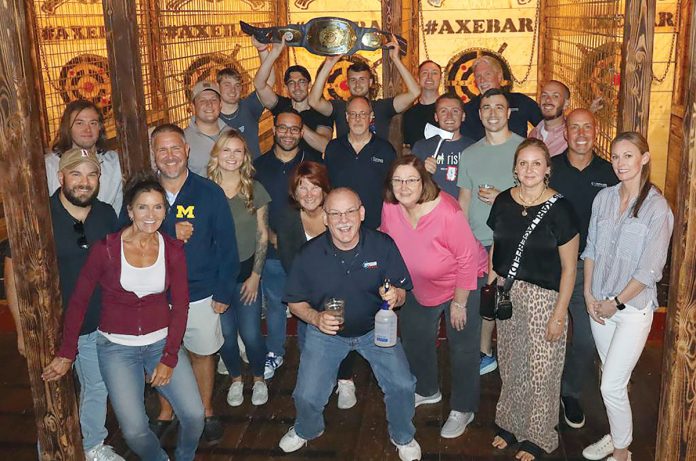 SHARP CROWD: Compass employees try their hand at axe-throwing during a company outing.
COURTESY COMPASS IT COMPLIANCE LLC SHARP CROWD: Compass employees try their hand at axe-throwing during a company outing.
COURTESY COMPASS IT COMPLIANCE LLC