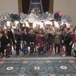 DECKING THE HALL: DarrowEverett LLP employees turn out for the company holiday party.  COURTESY DARROWEVERETT LLP