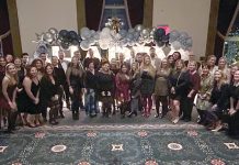 DECKING THE HALL: DarrowEverett LLP employees turn out for the company holiday party.  COURTESY DARROWEVERETT LLP