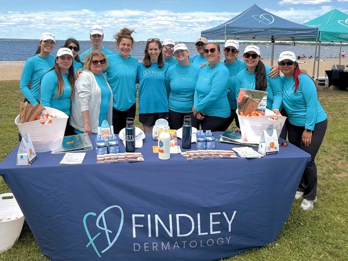 Safety in the sun: Findley employees staff a table providing skincare products at a local beach.
COURTESY FINDLEY DERMATOLOGY LLC Safety in the sun: Findley employees staff a table providing skincare products at a local beach.
COURTESY FINDLEY DERMATOLOGY LLC