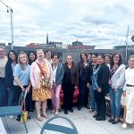 GREAT HEIGHTS: Hinckley, Allen & Snyder employees enjoy some time together at a rooftop restaurant in Providence. COURTESY HINCKLEY, ALLEN & SNYDER LLP