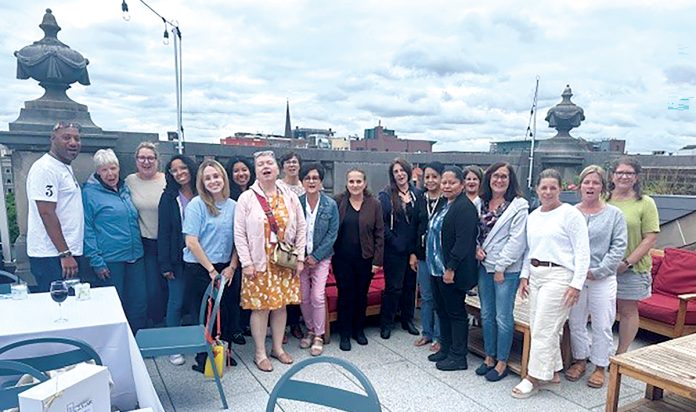 GREAT HEIGHTS: Hinckley, Allen & Snyder employees enjoy some time together at a rooftop restaurant in Providence.
COURTESY HINCKLEY, ALLEN & SNYDER LLP GREAT HEIGHTS: Hinckley, Allen & Snyder employees enjoy some time together at a rooftop restaurant in Providence.
COURTESY HINCKLEY, ALLEN & SNYDER LLP