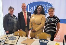 Lathrop Insurance bets on transparency, employee perks to build healthy workplace Motivated teaM: Lathrop Insurance employees at a professional event.
COURTESY LATHROP INSURANCE INC.