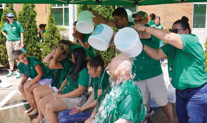 MAKING A SPLASH: Neighborhood Health staff members participate in an ice bucket “CEO Challenge” to support Rhode Islanders living with ALS. COURTESY NEIGHBORHOOD HEALTH PLAN OF RHODE ISLAND