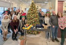 RIKB Design Build A JOLLY TIME: RIKB staff members gather around the tree at the company holiday party.
COURTESY RIKB DESIGN BUILD