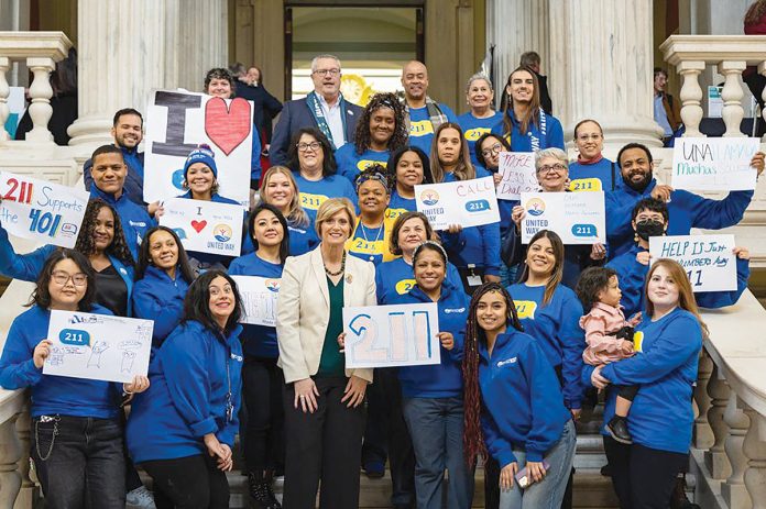 DIALED IN: United Way of Rhode Island staff members get the word out about the 211 help line.
COURTESY UNITED WAY OF RHODE ISLAND INC. DIALED IN: United Way of Rhode Island staff members get the word out about the 211 help line.
COURTESY UNITED WAY OF RHODE ISLAND INC.