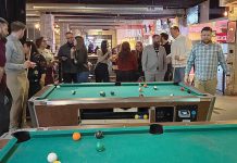 Pool night: Vertikal 6 employees enjoy a night playing billiards.  COURTESY VERTIKAL6 INC.
