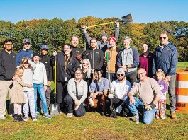 igus, Inc. Shovel ready: Igus employees are out in force for an outdoor community service project.
COURTESY IGUS INC.