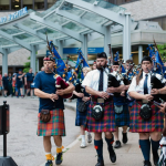 TARTAN ARMY bagpipe players lead the way past Rhode Island Hospital as Scottish soccer supporters stop at Hasbro Children's Hospital on June 18 to make a $10,000 donation. / COURTESY BROWN UNIVERSITY HEALTH