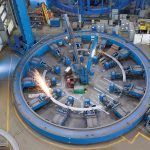 WORKFORCE PIPELINE: ­Mechanics work in one of Electric Boat’s metal fabrication “fixtures” used to build frames that reinforce a submarine’s pressure hull.  COURTESY GENERAL DYNAMICS ELECTRIC BOAT