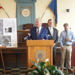 REP. SETH MAGAZINER, D-R.I., alongside Mayor Kenneth J. Hopkins and Town Council President Daniel Wall announces Tuesday that he has secured $1.1 million in federal funding to prevent flooding in Cranston's Garden Street area. / COURTESY CITY OF CRANSTON