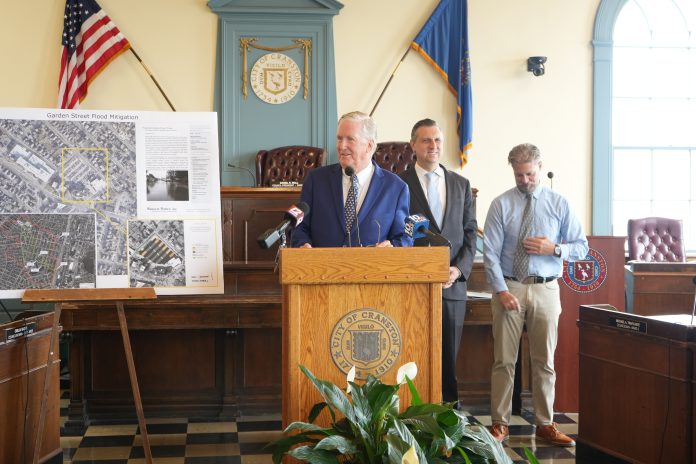 DSC05974 REP. SETH MAGAZINER, D-R.I., alongside Mayor Kenneth J. Hopkins and Town Council President Daniel Wall announces Tuesday that he has secured $1.1 million in federal funding to prevent flooding in Cranston's Garden Street area. / COURTESY CITY OF CRANSTON