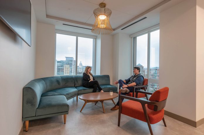 ROOM WITH A VIEW: A space that once served as a traditional conference room has been remodeled into an employee lounge populated with furniture that borrows from the mid-century modern style. The space can also be transformed into a client event space.
COURTESY HINCKLEY ALLEN ROOM WITH A VIEW: A space that once served as a traditional conference room has been remodeled into an employee lounge populated with furniture that borrows from the mid-century modern style. The space can also be transformed into a client event space.
COURTESY HINCKLEY ALLEN