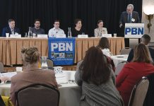 WORKING TOGETHER: The first panel featured, from left, Ted Williams, president of Senesco Marine LLC; Flux Marine Ltd. CEO Ben Sorkin; Jason Noel, operations executive at Juice Robotics LLC; Linda Larsen, maritime and industry engagement manager for Polaris Tech Bridge; and Daniela Fairchild, chief strategy officer for R.I. Commerce Corp. PBN Editor Michael Mello, right, moderates. PBN FILE PHOTO/MIKE SKORSKI
