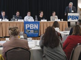 WORKING TOGETHER: The first panel featured, from left, Ted Williams, president of Senesco Marine LLC; Flux Marine Ltd. CEO Ben Sorkin; Jason Noel, operations executive at Juice Robotics LLC; Linda Larsen, maritime and industry engagement manager for Polaris Tech Bridge; and Daniela Fairchild, chief strategy officer for R.I. Commerce Corp. PBN Editor Michael Mello, right, moderates. PBN FILE PHOTO/MIKE SKORSKI