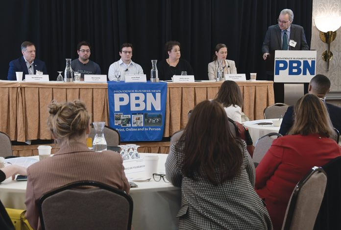 WORKING TOGETHER: The first panel featured, from left, Ted Williams, president of Senesco Marine LLC; Flux Marine Ltd. CEO Ben Sorkin; Jason Noel, operations executive at Juice Robotics LLC; Linda Larsen, maritime and industry engagement manager for Polaris Tech Bridge; and Daniela Fairchild, chief strategy officer for R.I. Commerce Corp. PBN Editor Michael Mello, right, moderates. PBN FILE PHOTO/MIKE SKORSKI