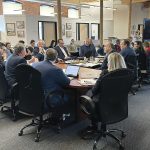 IN GOOD COMPANY: The R.I. Commerce Corp. board meets at Cumberland-based baby product company Baby Delight Inc. in June for a strategic retreat to discuss economic and workforce trends. Gov. Daniel J. McKee, third from the left, leads the meeting.  COURTESY R.I. COMMERCE CORP.