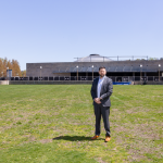 R.I. PUBLIC TRANSIT AUTHORITY CEO Christopher Durand stands in a field next to the Providence train station, one of two parcels being considered for a new central transit hub. PBN FILE PHOTO/TRACY JENKINS