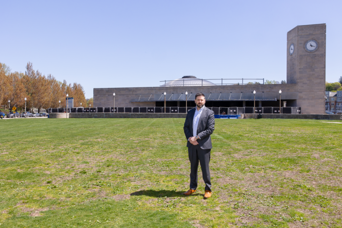 hottopic731 R.I. PUBLIC TRANSIT AUTHORITY CEO Christopher Durand stands in a field next to the Providence train station, one of two parcels being considered for a new central transit hub. PBN FILE PHOTO/TRACY JENKINS