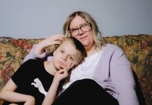 UP FOR A FIGHT: Lindsey Althaus and her son, Whitman Althaus, 12, who has autism and a neurological disorder called apraxia, in their home on July 1 in Luckey, Ohio. AP PHOTO/NIC ANTAYA