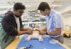 URI team developing smart wearable to monitor health of premature babies TEST BED: Abdullah al Rumon, left, and Dr. Kunal Mankodiya, director of the Wearable Biosensing Lab at the University of Rhode Island, are part of a team developing a smart strap that can monitor the health condition of premature babies.
PBN PHOTO/ELIZABETH GRAHAM