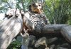 TROLL ­SIGHTING: ­ Louise Bishop, South County Tourism Council CEO and president, visits one of the two trolls living in the woods of Ninigret Park in Charlestown. Bishop says the trolls, made of recycled materials, have drawn 100,000 visitors this year alone. Three more trolls have been installed recently in Rhode Island.  PBN FILE PHOTO/­ELIZABETH GRAHAM