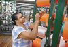 STRING SKILLS: ­Machine operator Maria Dacruz works on the production floor of Neocorp Inc., a standard and technical rope and bungee cord maker in Pawtucket. Neocorp was among the local manufacturers that dealt with inflated tariffs in 2025.  PBN FILE PHOTO/­MICHAEL SALERNO
