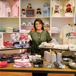 TAKE A LOOK: Paola Baldomar, owner of online apparel brand Rhody & Co., displays items at a pop-up at Providence Place mall.   PBN PHOTO/MICHAEL SALERNO