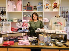 Baldomar created Rhody apparel company to honor her late husband TAKE A LOOK: Paola Baldomar, owner of online apparel brand Rhody & Co., displays items at a pop-up at Providence Place mall.
PBN PHOTO/MICHAEL SALERNO