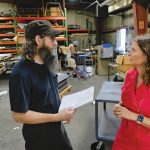 Mularski is lighting the way for her clients SHINING BRIGHT:
Rich Reynolds, left, fabrication supervisor, speaks with Jessica Mularski, majority owner, at Renova Lighting Systems Inc. in Warwick.
PBN PHOTO/MICHAEL SALERNO