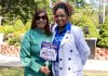 PROVIDENCE DEMOCRATS Sen. Ana Quezada, left, and Rep. Grace Diaz at the ceremonial bill signing of legislation creating a license plate honoring Dominican culture on Aug. 14 at Roger Williams Park. The legislators introduced the bills to the General Assembly to establish the new license plates. / COURTESY R.I. GENERAL ASSEMBLY