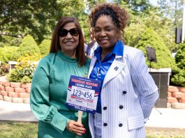 PROVIDENCE DEMOCRATS Sen. Ana Quezada, left, and Rep. Grace Diaz at the ceremonial bill signing of legislation creating a license plate honoring Dominican culture on Aug. 14 at Roger Williams Park. The legislators introduced the bills to the General Assembly to establish the new license plates. / COURTESY R.I. GENERAL ASSEMBLY