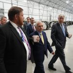 L3HARRIS TECHNOLOGIES INC. executives lead Sen. Sheldon Whitehouse, D-R.I., right, and Sen. Jack Reed, D-R.I., center, through its new 50,000-square-foot production facility at ProvPort. The new site will support the integration and testing of undersea training ranges for U.S. and partner-nation fleets, the company said. / COURTESY L3HARRIS TECHNOLOGIES INC.