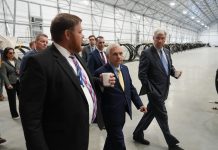 L3HARRIS TECHNOLOGIES INC. executives lead Sen. Sheldon Whitehouse, D-R.I., right, and Sen. Jack Reed, D-R.I., center, through its new 50,000-square-foot production facility at ProvPort. The new site will support the integration and testing of undersea training ranges for U.S. and partner-nation fleets, the company said. / COURTESY L3HARRIS TECHNOLOGIES INC.