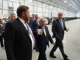 L3HARRIS TECHNOLOGIES INC. executives lead Sen. Sheldon Whitehouse, D-R.I., right, and Sen. Jack Reed, D-R.I., center, through its new 50,000-square-foot production facility at ProvPort. The new site will support the integration and testing of undersea training ranges for U.S. and partner-nation fleets, the company said. / COURTESY L3HARRIS TECHNOLOGIES INC.