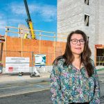For homebuyers, landscape grows more discouraging UNDER CONSTRUCTION: Michelle Wilcox, CEO and president of Crossroads Rhode Island, stands in front of the Summer Street Apartments project in Providence in 2024. It’s Crossroads’ five-story building featuring 176 single-bed residences for those who were previously homeless.
PBN FILE PHOTO/MICHAEL SALERNO